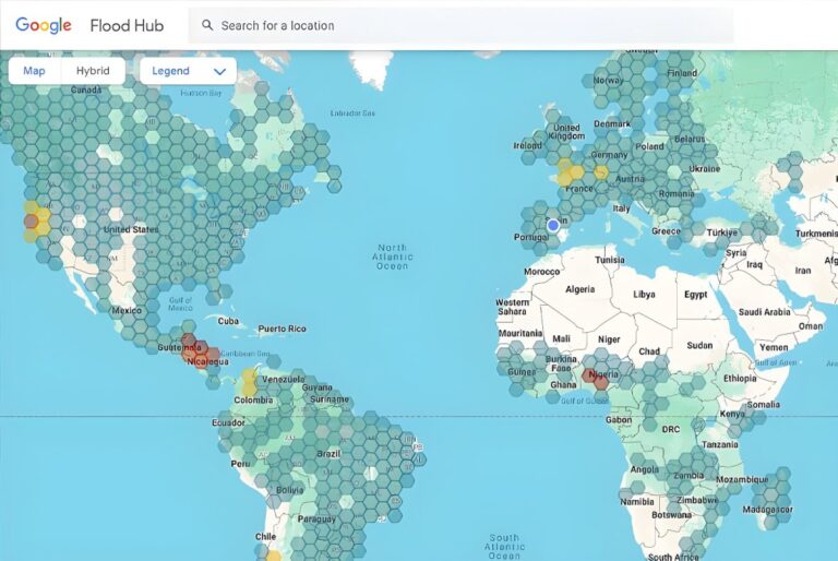 Screenshot of the Google Flood Hub interface showing a global map with hexagonal data overlays across several continents.