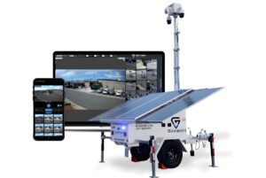 GoView solar-powered mobile surveillance trailer with a camera mast alongside a monitor and smartphone showing video feeds.