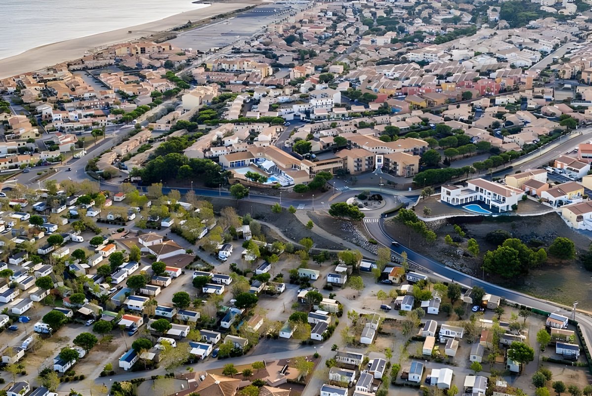 Aerial drone view of a coastal residential neighborhood and holiday park in Grand Narbonne, France.