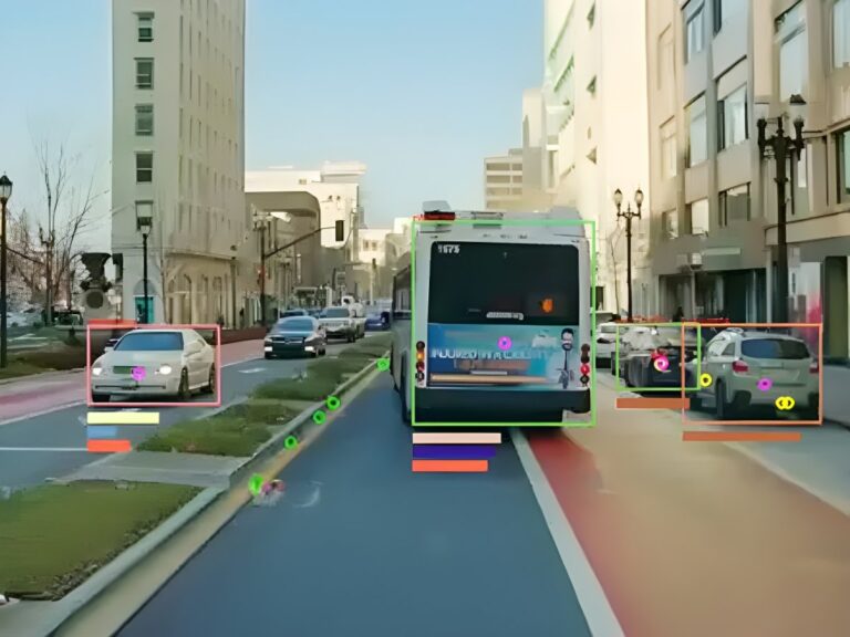 Hayden AI perception system interface showing digital bounding boxes around a bus and cars on a city street.