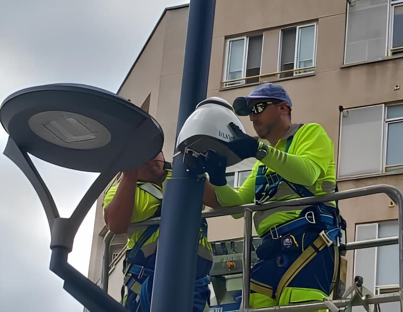 Engineer installing noise and air monitoring stations