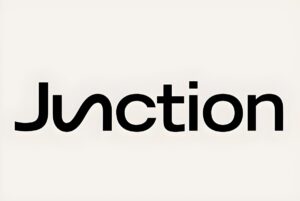 Black Junction logo with a stylized letter u on a light beige background.