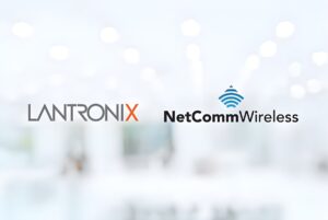 Lantronix and NetComm Wireless logos displayed side-by-side against a blurred white office background.