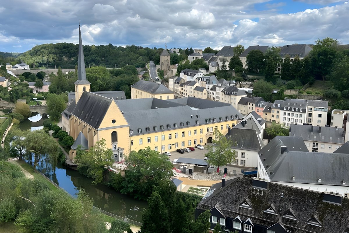 Aerial view of Neumünster Abbey and the Alzette river in the Grund district of Luxembourg City.