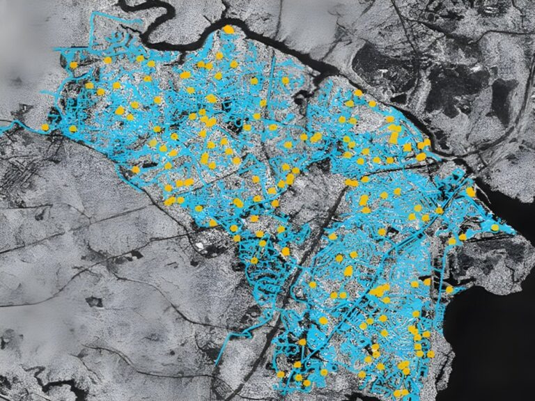 Satellite radar map of a geographic region with blue shaded areas and yellow data points indicating network locations.