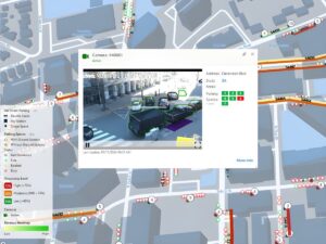 Umojo curb management software interface showing a digital city map with a live camera feed of vehicles on a street.