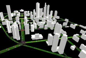 3D digital twin model of a city skyline with white block buildings and green highlighted road networks on a black background.