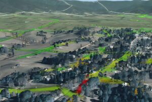 Neara 3D digital twin model of a rural landscape with utility line corridors highlighted in green and red.