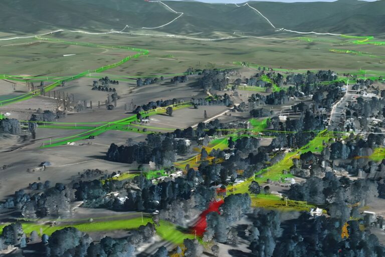 Neara 3D digital twin model of a rural landscape with utility line corridors highlighted in green and red.