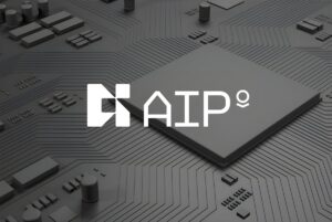 The Palantir AIP logo overlaid on a dark grey 3D rendering of a computer processor and circuit board.