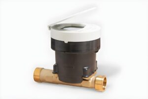 An Itron smart water meter with a brass pipe base and a black and white digital display unit on a plain background.