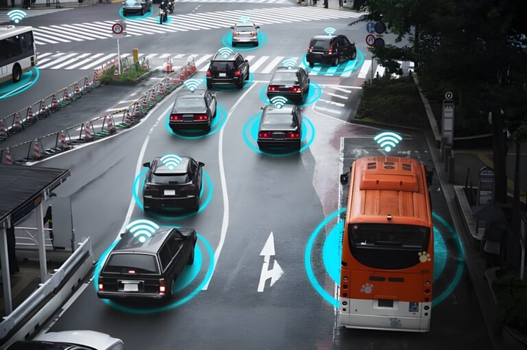 High-angle view of city traffic with digital blue circles and signal icons overlaid on cars and a bus to represent V2X tech.