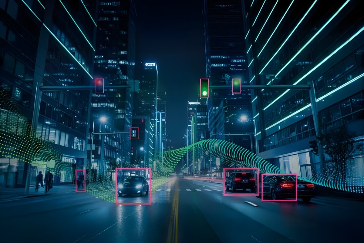 Digital city street at night with cars and pedestrians highlighted by glowing data overlays and bounding boxes.