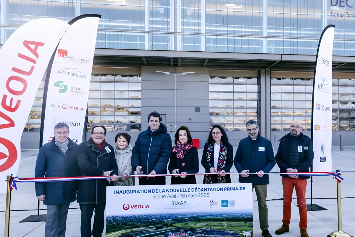 Officials cut a ribbon at a Veolia inauguration ceremony for a new primary decantation unit at a wastewater plant.