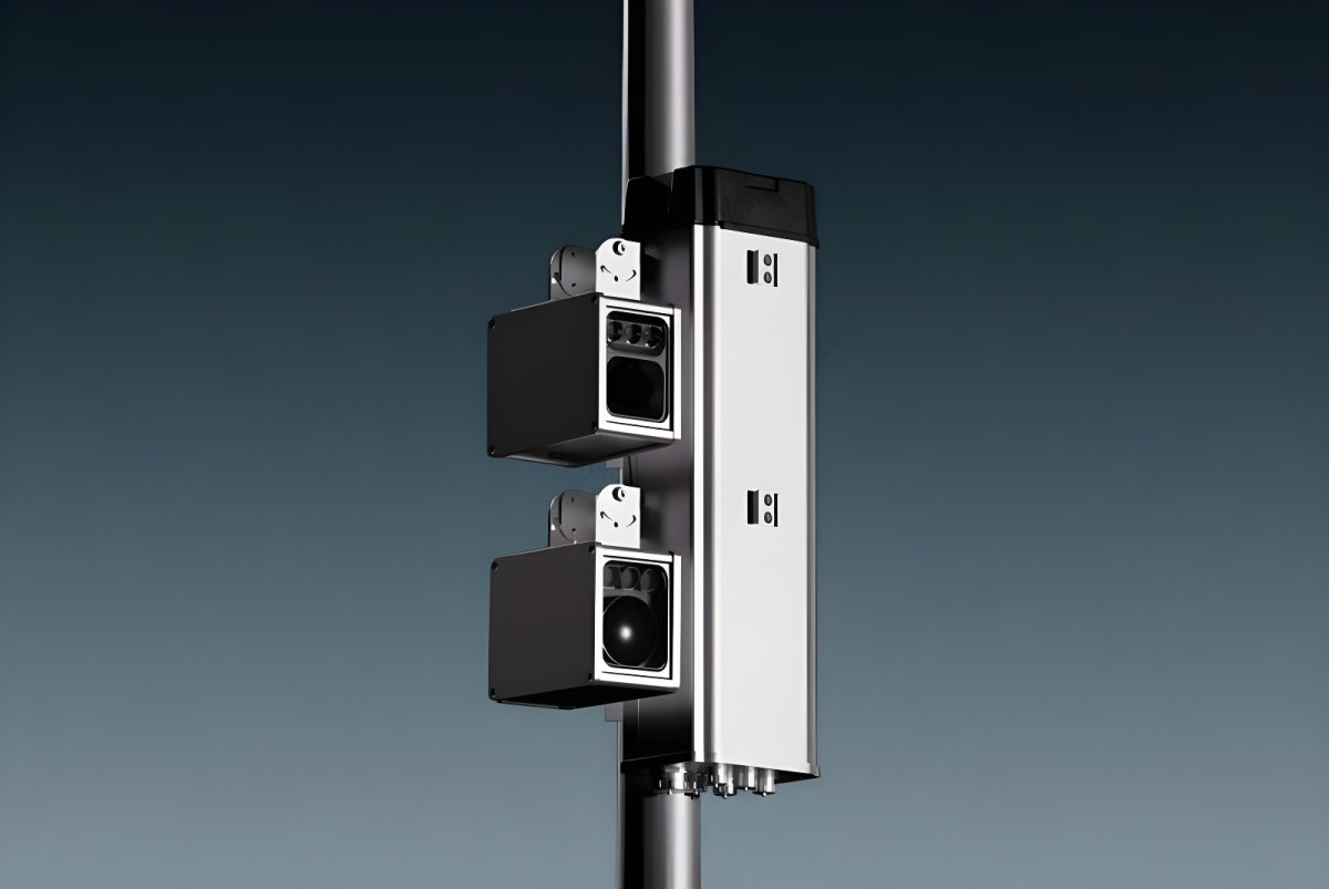 Two Vizzia video surveillance cameras and a silver processing unit mounted on a metal utility pole.
