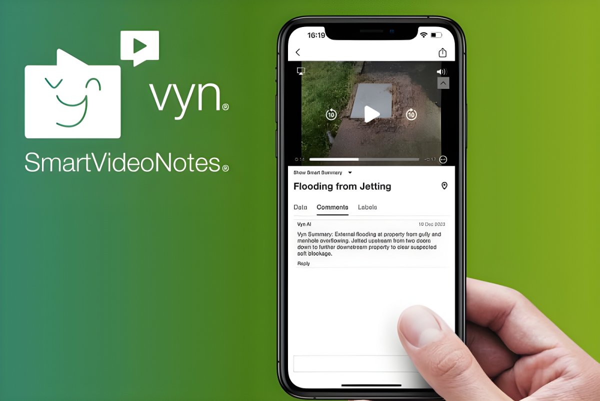 A hand holding a smartphone displaying the Vyntelligence SmartVideoNotes app interface against a green background.