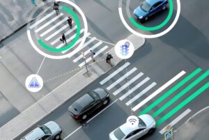 Aerial view of a city crosswalk with digital overlays tracking pedestrians and vehicles for smart traffic management.