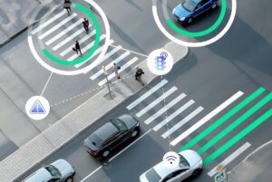 Aerial view of a city intersection with digital overlays highlighting pedestrians, vehicles, and traffic signal icons.