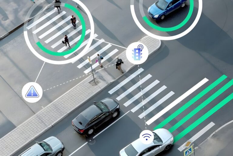 Aerial view of a city intersection with digital overlays highlighting pedestrians, vehicles, and traffic signal icons.