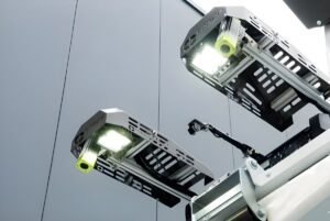 Two C-Trace automated waste identification cameras with LED lights mounted on a refuse collection vehicle.