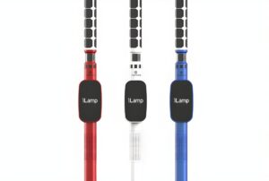 Three iLamp smart street poles in red, white, and blue featuring integrated solar panels and digital displays.